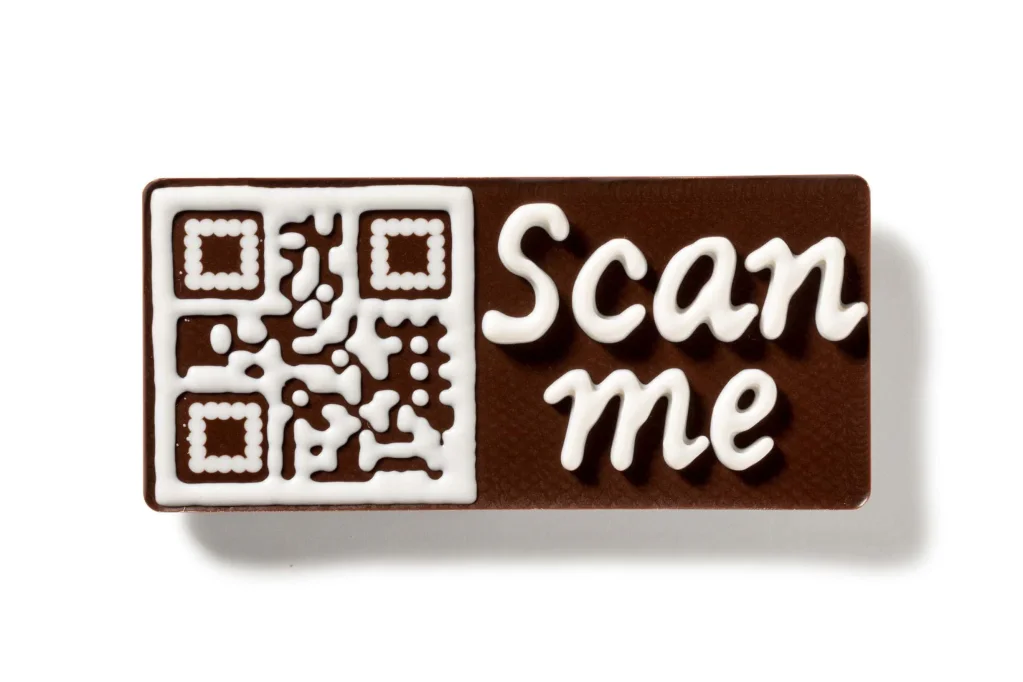 Milk chocolate bar with a 3D QR code in white chocolate, deposited by a FoodJet tempered chocolate depositor