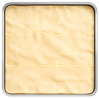 Baking tray with a layer of lasagne sheets before depositing