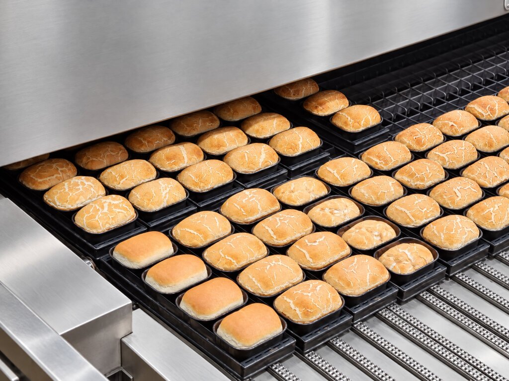 Tiger buns leaving a tunnel oven